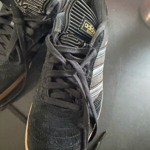 Adidas Black and Gold Sneakers.